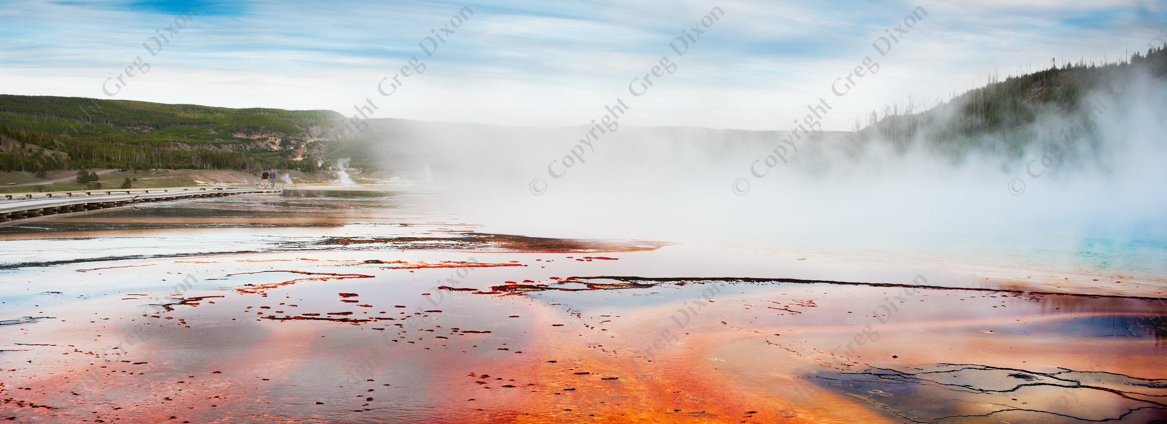 "Walk of Fire"  Yellowstone National Park  Grand Prismatic Spring | A couple traverses the boardwalk as the sun sets over Grand Prismatic Spring in Yellowstone National Park's Midway Geyser Basin on Saturday, June 1, 2013 | Signature Edition Print by Greg Dixon | Digital Photograph